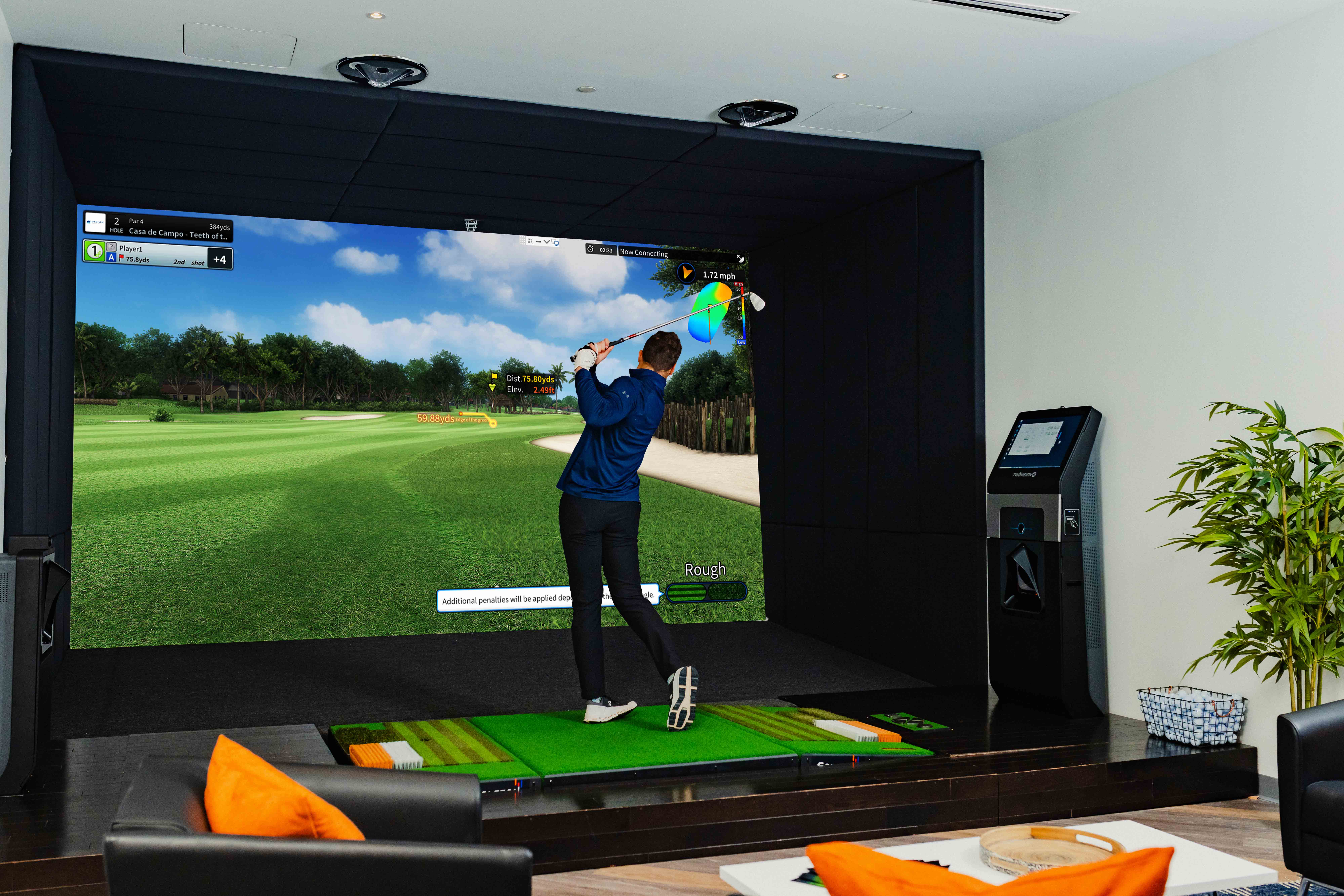 Young Man Playing An Indoor Golf Simulator_Golfzon